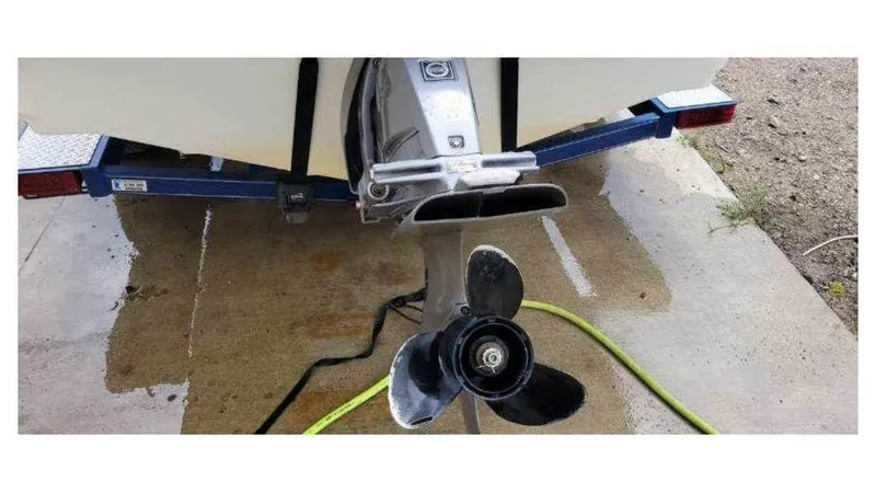 Slide: The Image of 2008 Larson 180 Sport boat propeller and trailer close-up. - 2