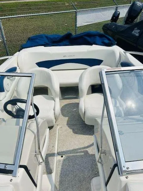 Slide: The Image of 2008 Larson 180 Sport boat interior with seating and windshield. - 4