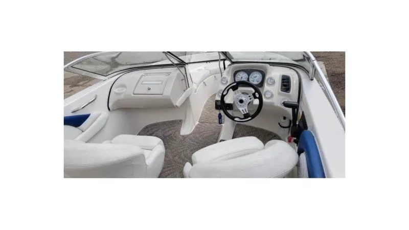 Slide: The Image of Interior of a 2008 Larson 180 Sport boat with steering wheel and dashboard. - 6
