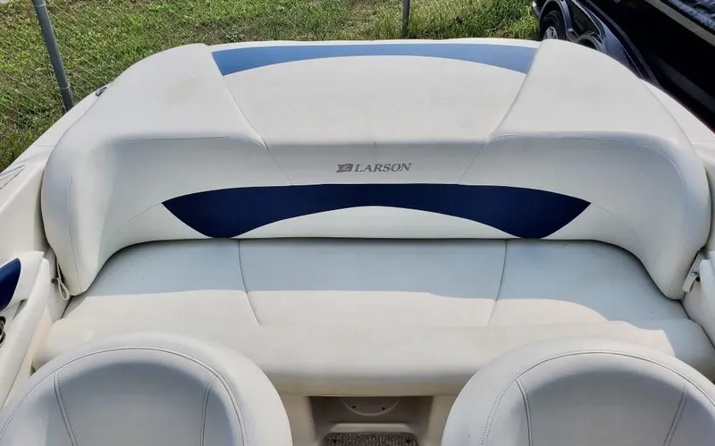 Slide: The Image of 2008 Larson 180 Sport boat interior with white and blue seating. - 9
