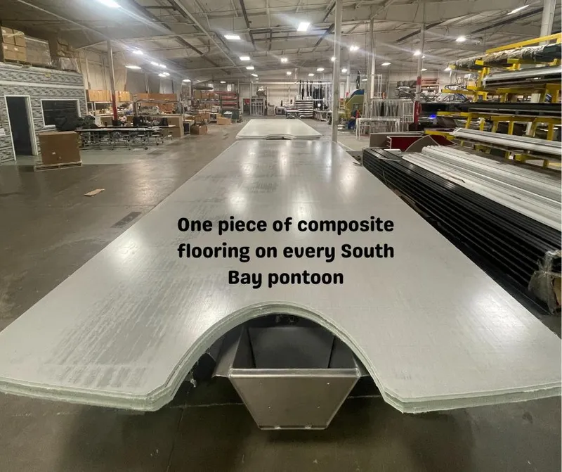 Slide: The Image of 2023 South Bay 224FCR3.0 pontoon with composite flooring in a manufacturing facility. - 7