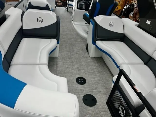 Slide: The Image of 2023 South Bay 523RS ARCH3.0 boat interior with white and blue seating. - 4