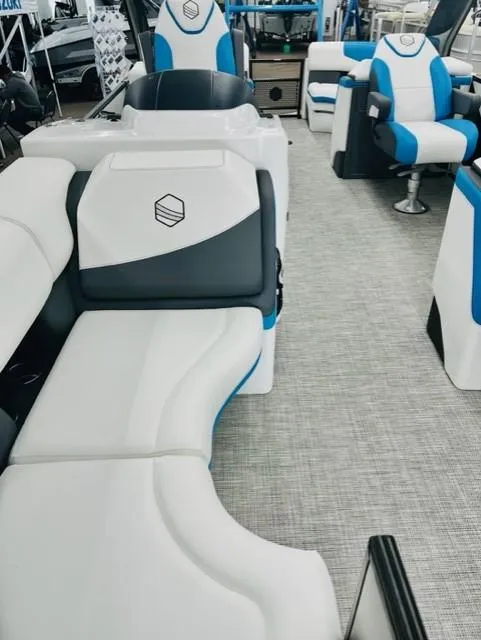 Slide: The Image of 2023 South Bay 523RS ARCH3.0 pontoon boat interior with white and blue seating. - 8