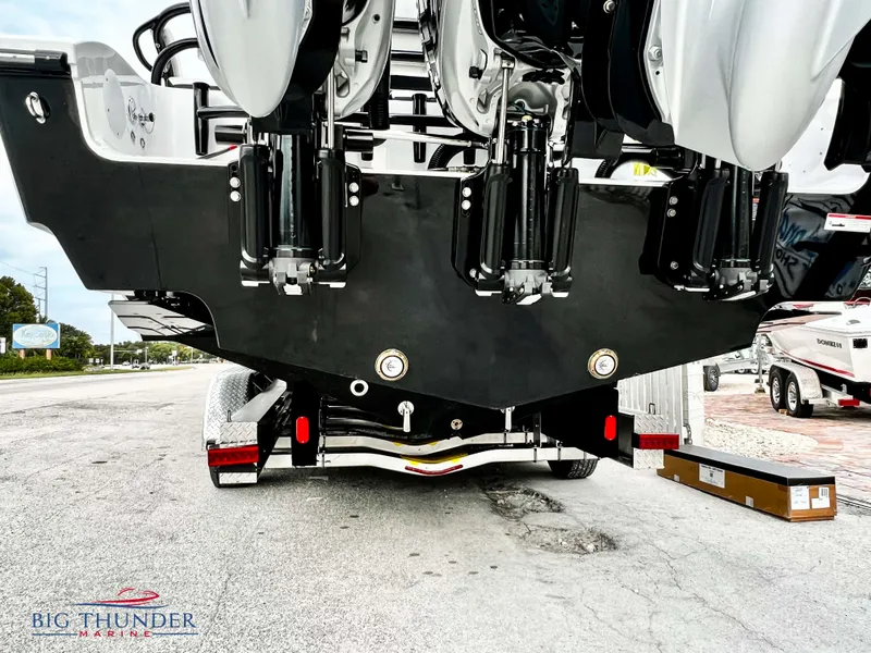 Slide: The Image of 2023 Fountain 38 TE boat rear view with triple outboard engines. - 10