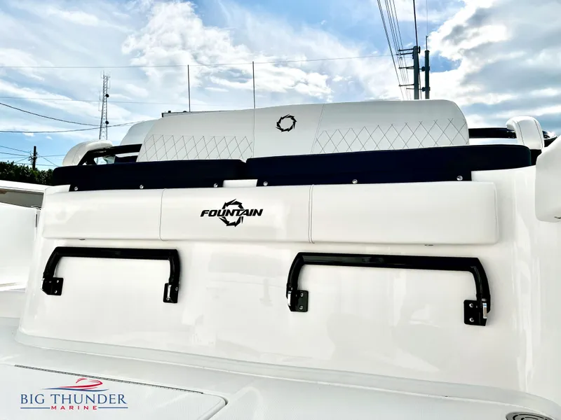 Slide: The Image of 2023 Fountain 38 TE boat rear seating with logo, Big Thunder Marine branding. - 12