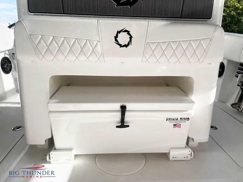 Slide: The Image of 2023 Fountain 38 TE boat interior with Frigid Rigid cooler and Big Thunder Marine logo. - 16