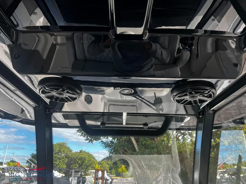 Slide: The Image of 2023 Fountain 38 TE boat interior with speakers and overhead console. - 19