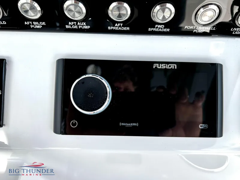 Slide: The Image of Control panel of a 2023 Fountain 38 TE boat with Fusion audio system. - 25