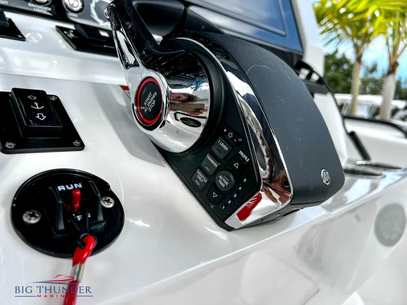Slide: The Image of Close-up of 2023 Fountain 38 TE boat throttle controls. - 28