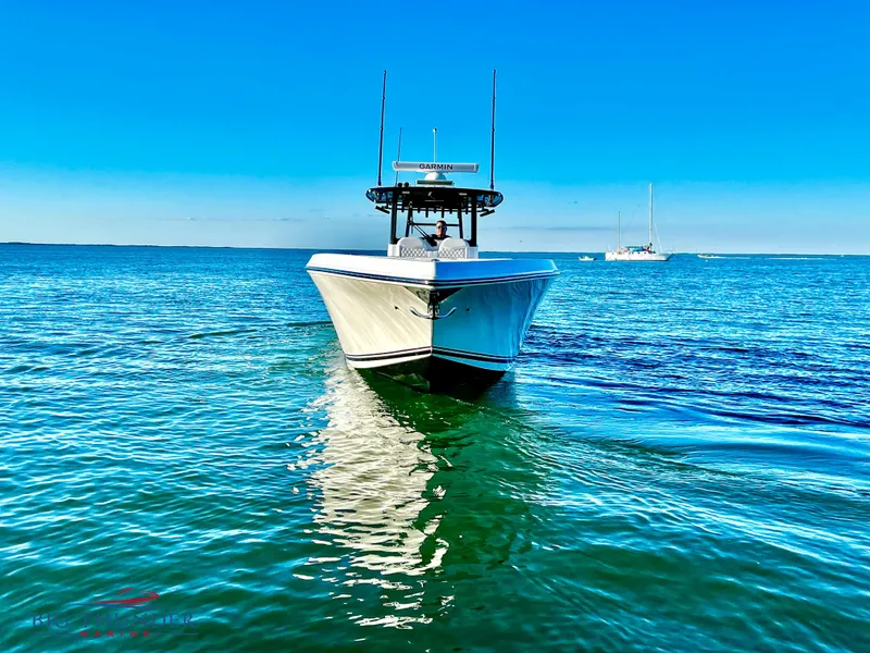 Slide: The Image of 2023 Fountain 38 TE boat on clear blue water. - 3