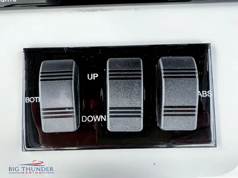 Slide: The Image of Close-up of control switches on a 2023 Fountain 38 TE boat. - 31
