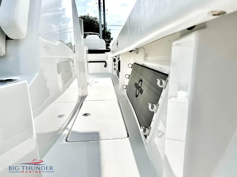 Slide: The Image of 2023 Fountain 38 TE boat interior with Big Thunder Marine logo. - 38