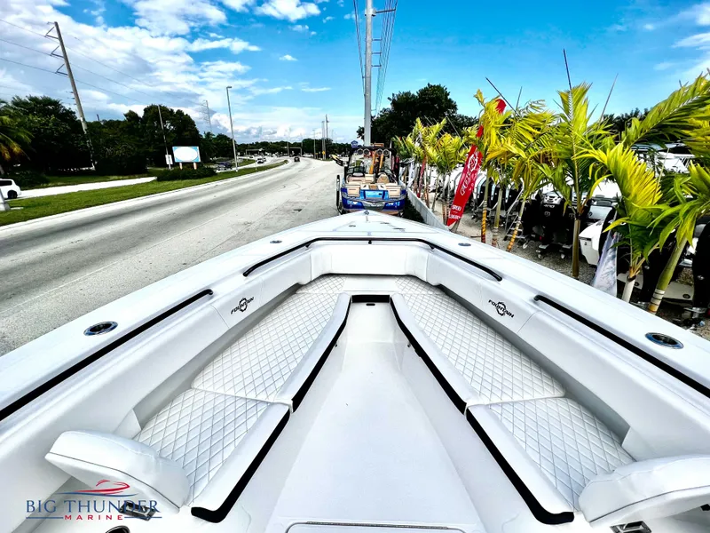 Slide: The Image of 2023 Fountain 38 TE boat with white seating, displayed at Big Thunder Marine. - 42