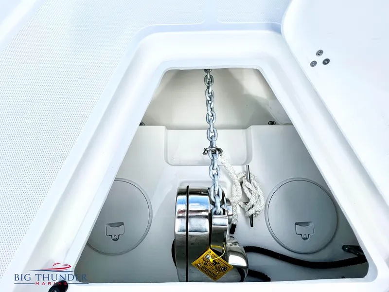 Slide: The Image of Anchor locker of a 2023 Fountain 38 TE boat with chain and windlass. - 44