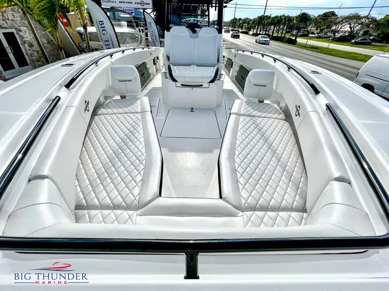 Slide: The Image of 2023 Fountain 38 TE boat with luxurious white seating and diamond stitching. - 46