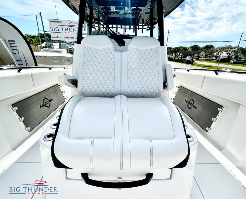 Slide: The Image of 2023 Fountain 38 TE boat interior with white cushioned seating. - 49