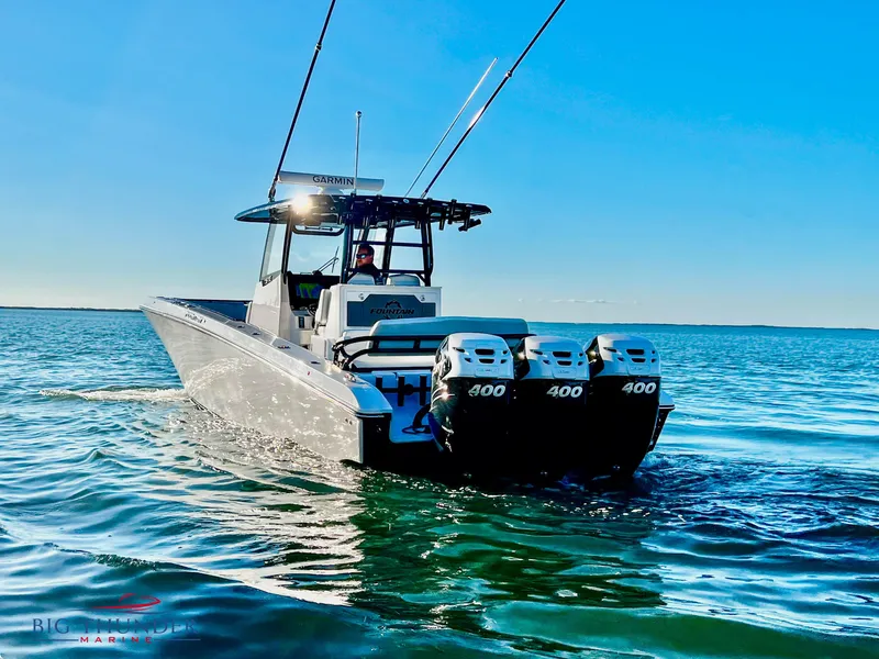 Slide: The Image of 2023 Fountain 38 TE boat with triple 400 horsepower engines on the water. - 5