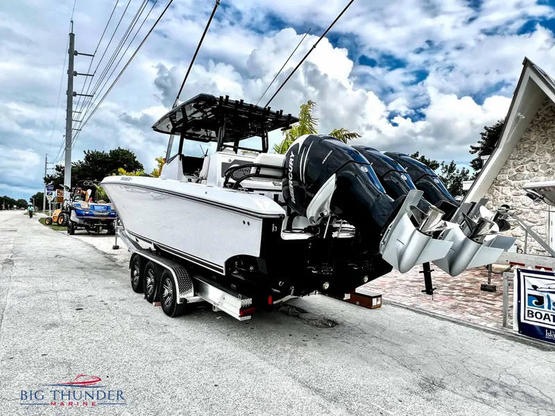 Slide: The Image of 2023 Fountain 38 TE boat on trailer with triple outboard engines. - 8