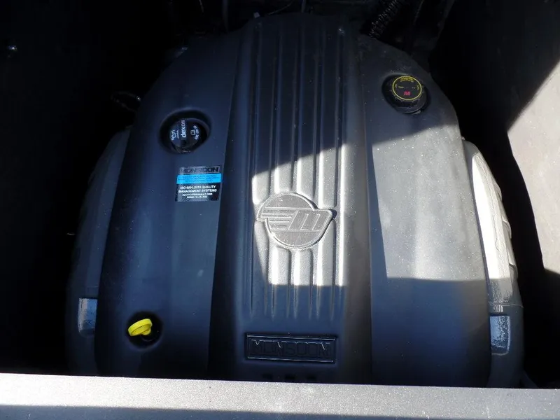 Slide: The Image of 2023 Axis T235 engine compartment with visible components and branding. - 10