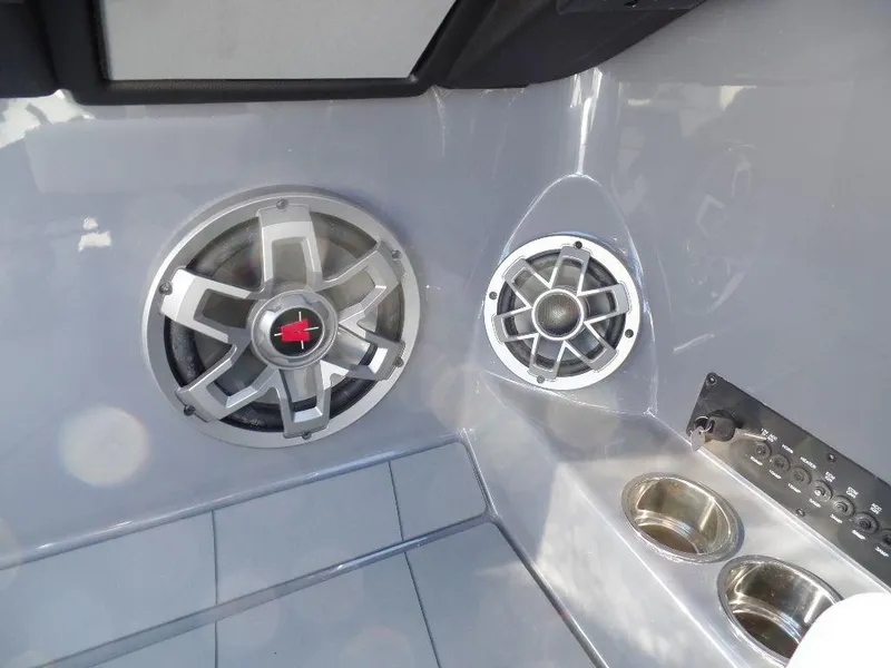 Slide: The Image of 2023 Axis T235 boat interior with speakers and cup holders. - 11