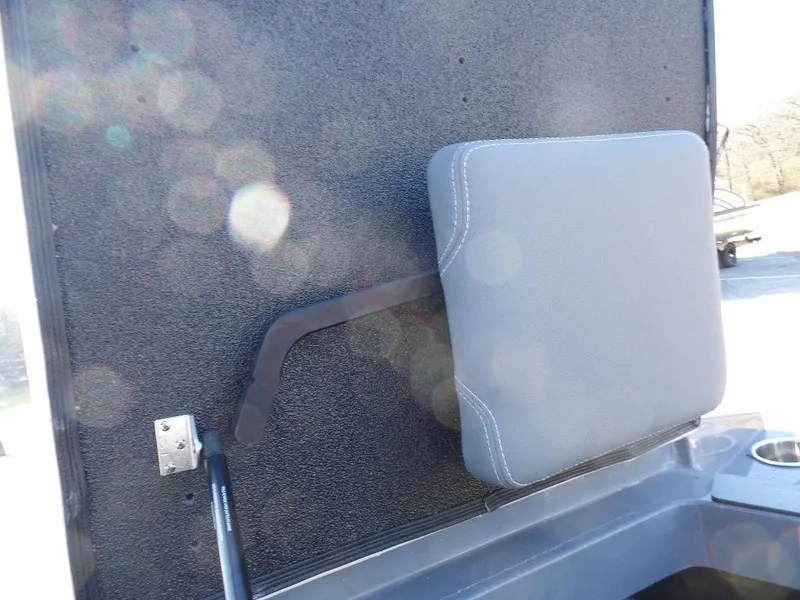 Slide: The Image of 2023 Axis T235 boat seat with gray cushion and textured backdrop. - 12