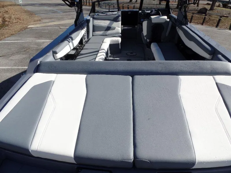 Slide: The Image of 2023 Axis T235 boat interior with gray and white seating, spacious layout. - 4
