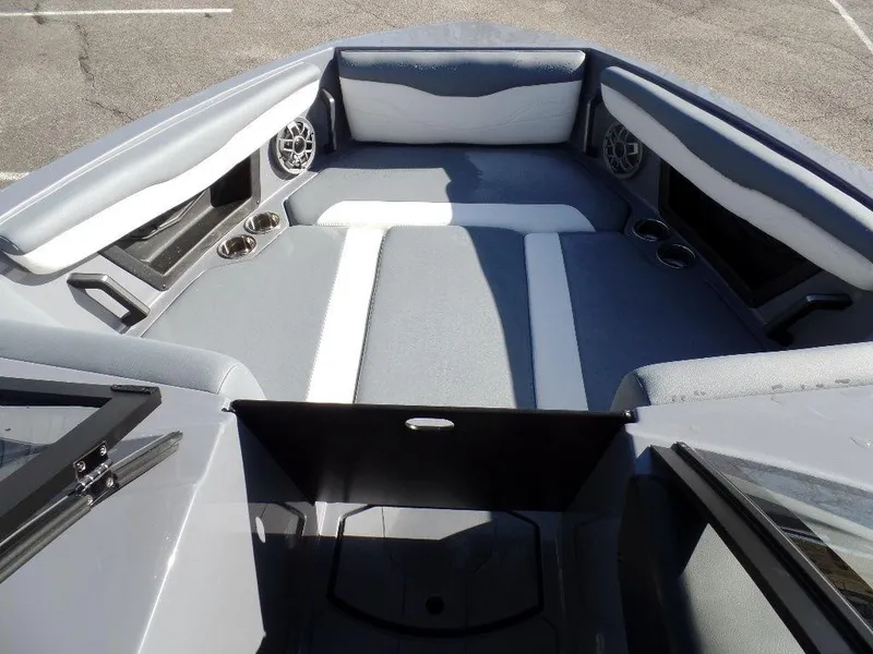 Slide: The Image of 2023 Axis T235 boat interior with gray seating and cup holders. - 6