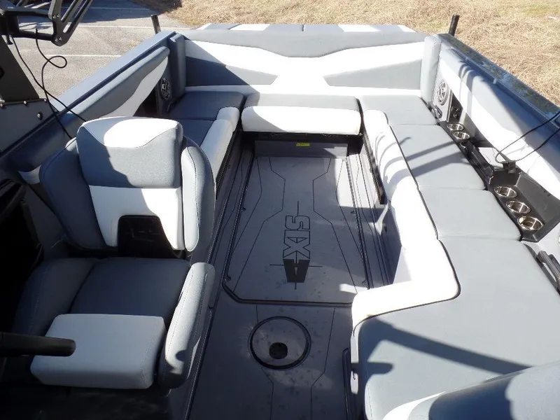 Slide: The Image of 2023 Axis T235 boat interior with gray seating and spacious layout. - 7