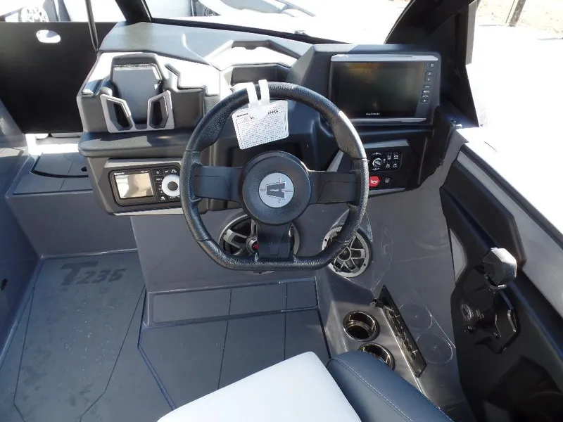 Slide: The Image of 2023 Axis T235 boat dashboard with steering wheel and control panel. - 9