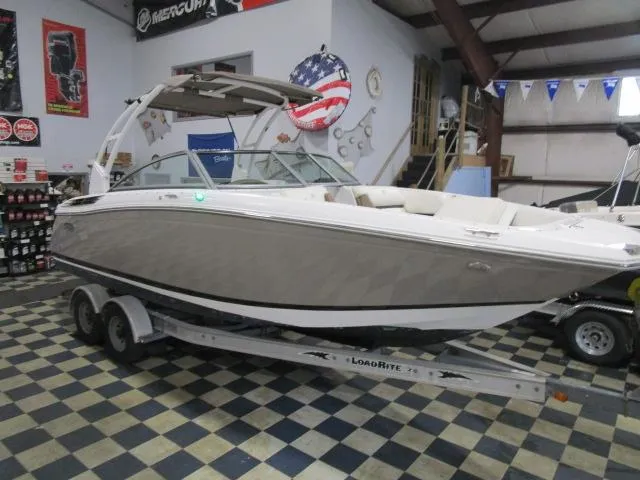 Slide: The Image of 2014 Cobalt 26 SD boat on trailer in showroom. - 1