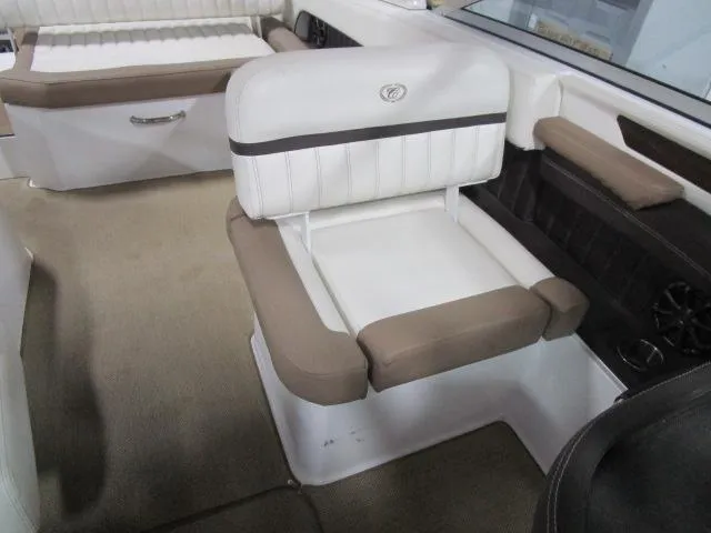 Slide: The Image of 2014 Cobalt 26 SD boat interior with beige and white seating. - 11
