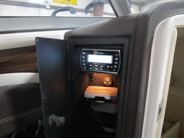 Slide: The Image of 2014 Cobalt 26 SD boat dashboard with stereo and Garmin device. - 17