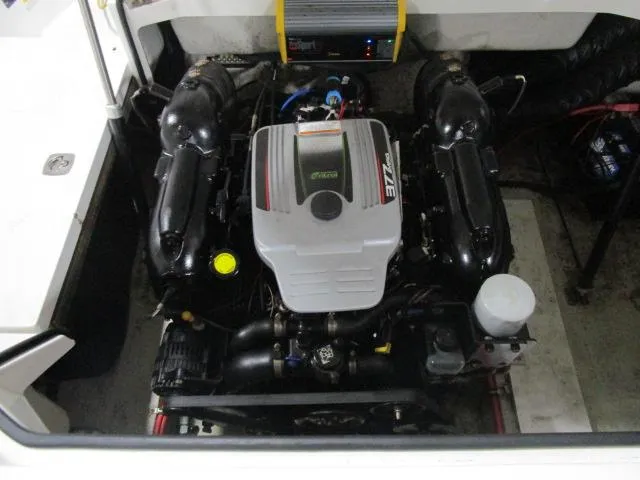 Slide: The Image of 2014 Cobalt 26 SD engine compartment with a powerful marine engine. - 21