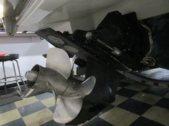 Slide: The Image of Close-up of 2014 Cobalt 26 SD boat propeller on checkered floor. - 22