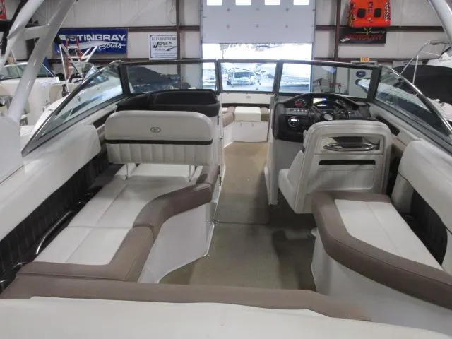 Slide: The Image of 2014 Cobalt 26 SD boat interior with beige and white seating. - 5