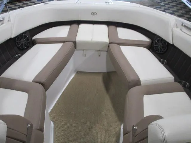 Slide: The Image of 2014 Cobalt 26 SD boat interior with beige and white seating. - 8
