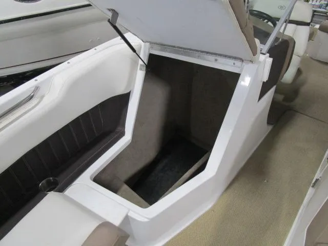 Slide: The Image of 2014 Cobalt 26 SD boat interior storage compartment with open hatch. - 9