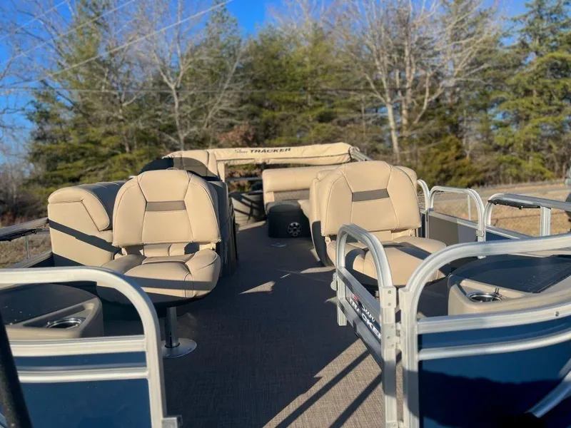Slide: The Image of 2023 Sun Tracker FISHIN' BARGE® 20 DLX pontoon boat with beige seating. - 11