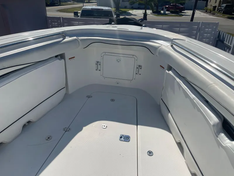 Slide: The Image of 2006 Wellcraft 310 CC boat interior, spacious seating and storage compartments. - 21