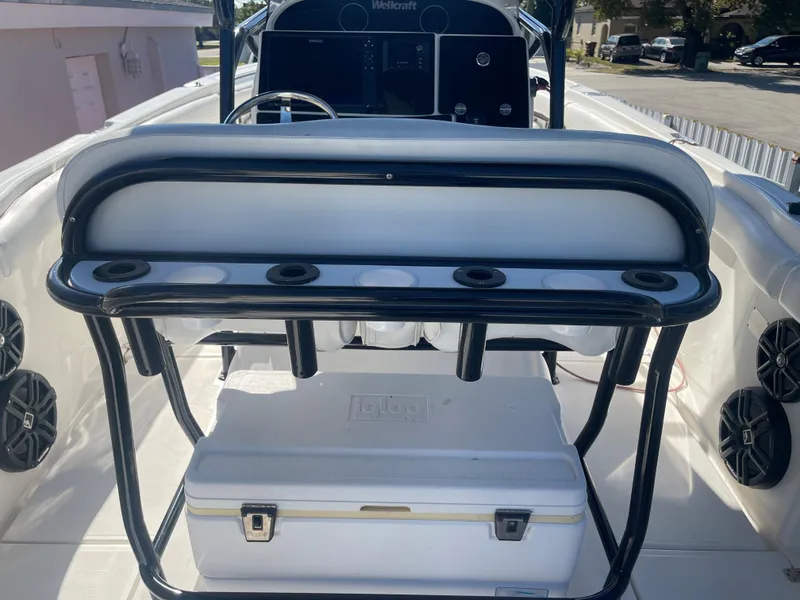 Slide: The Image of 2006 Wellcraft 310 CC boat interior with seating and cooler. - 22