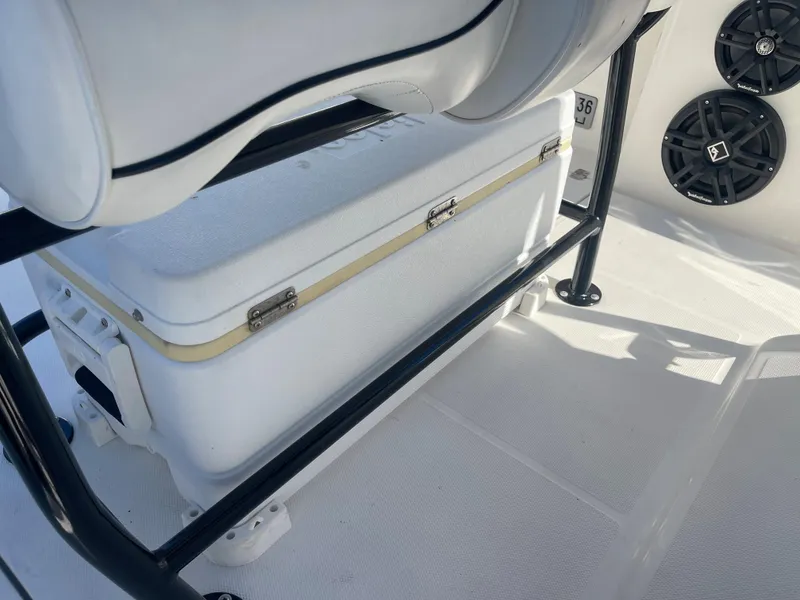 Slide: The Image of Cooler storage under seat on 2006 Wellcraft 310 CC boat. - 30