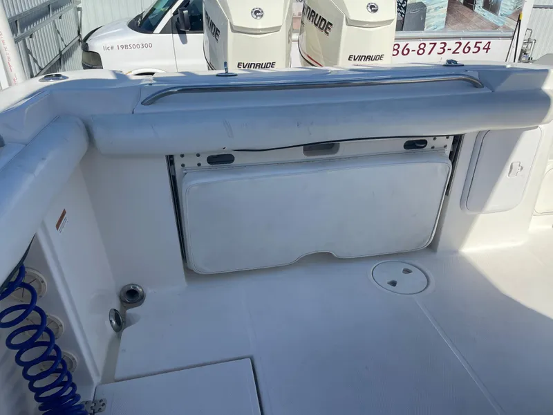 Slide: The Image of 2006 Wellcraft 310 CC boat interior with Evinrude engines in the background. - 37