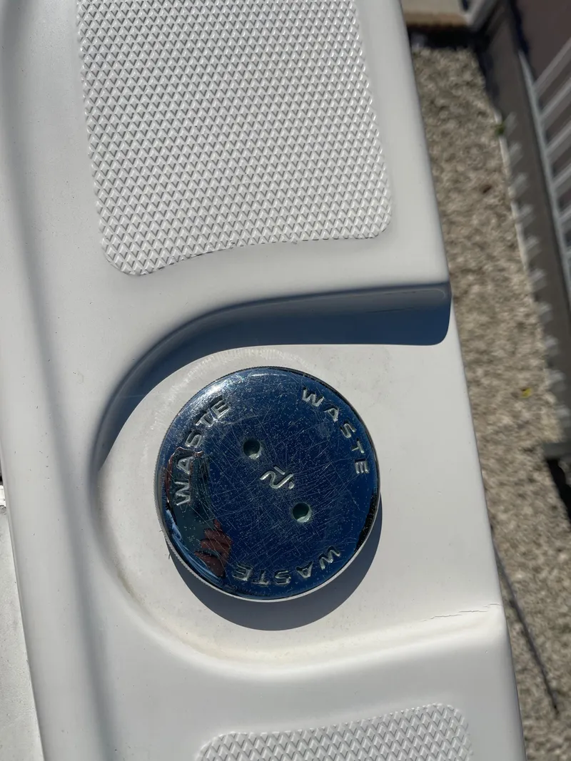 Slide: The Image of 2006 Wellcraft 310 CC waste cap on deck. - 39