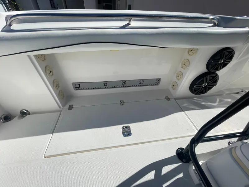 Slide: The Image of 2006 Wellcraft 310 CC boat deck with storage and speakers. - 42