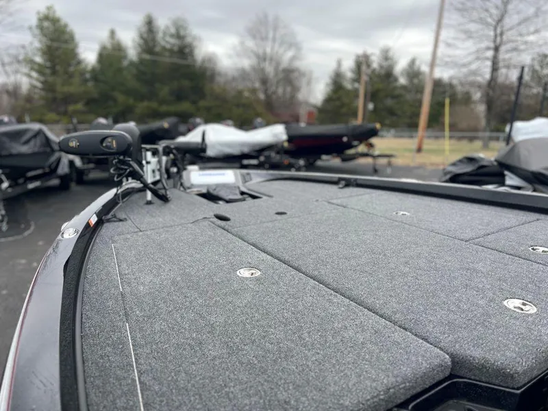 Slide: The Image of 2023 Ranger Z518 fishing boat deck with trolling motor in outdoor setting. - 4