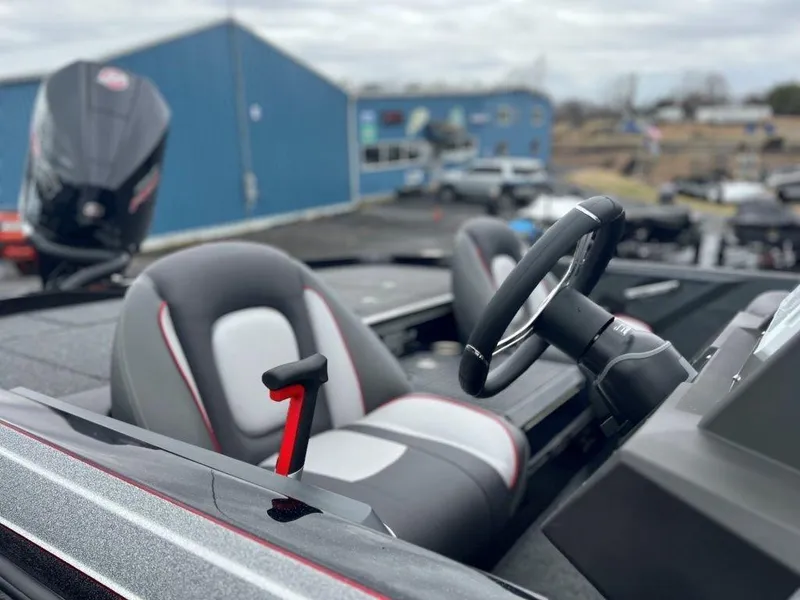 Slide: The Image of 2023 Ranger Z518 boat interior with steering wheel and seats. - 7