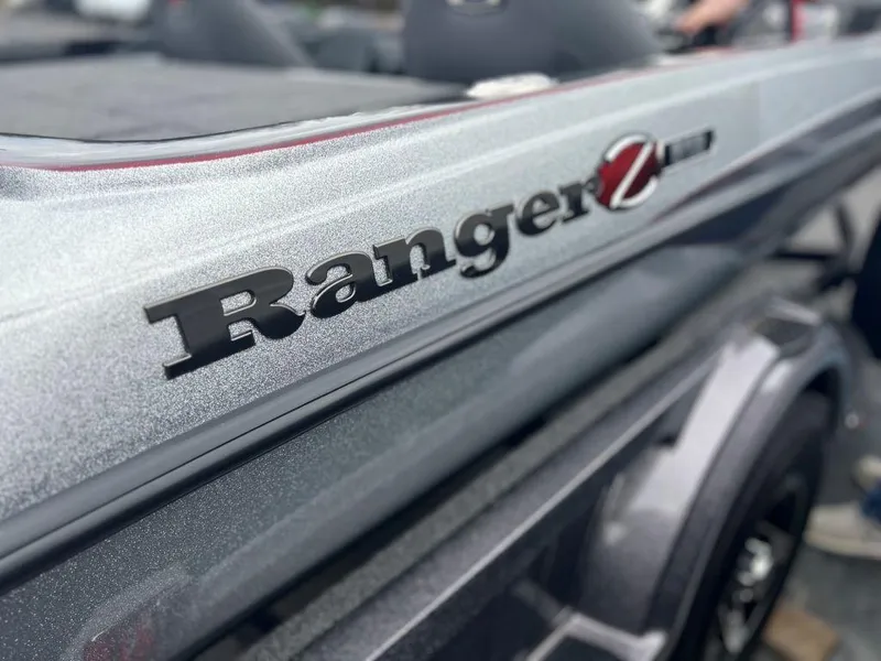 Slide: The Image of 2023 Ranger Z518 boat close-up showing logo and sleek design. - 9
