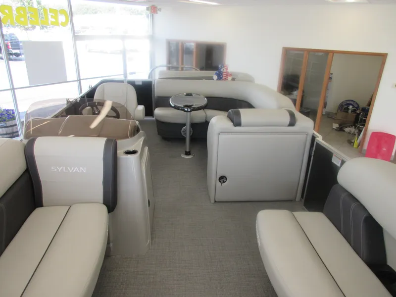 Slide: The Image of 2023 Sylvan 820 Mirage Cruise RE pontoon boat interior with spacious seating and modern design. - 3