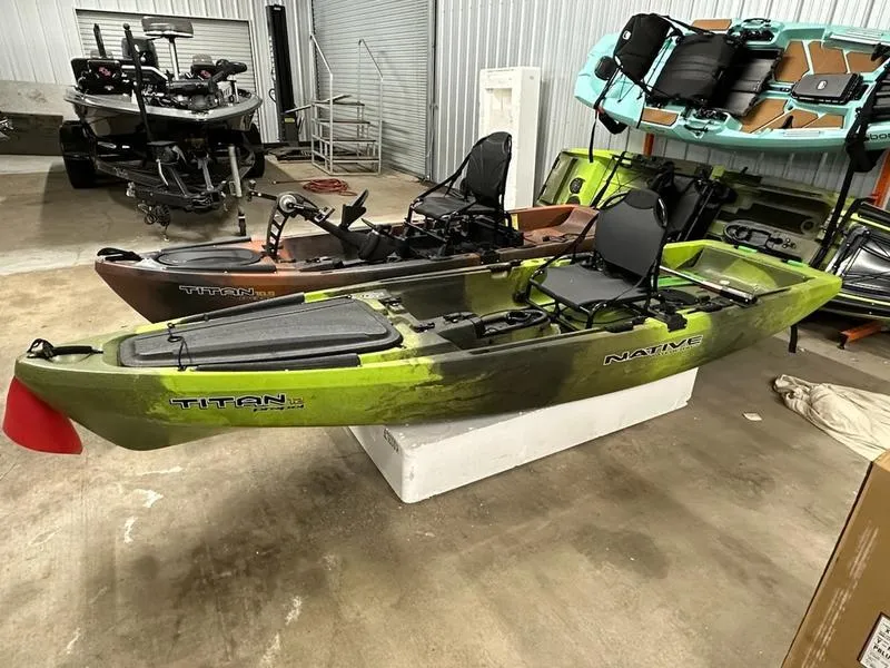 The Image of 2021 Native Watercraft TITAN PROPEL 12 GRN kayak in storage facility. - 1