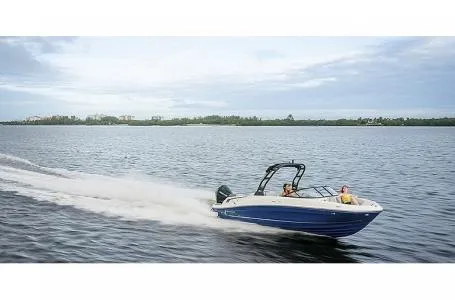 Slide: The Image of 2023 Bayliner VR6 Bowrider Outboard speeding on a lake. - 10